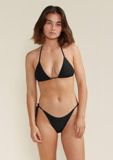 Model wearing Alex string bikini top in colour black
