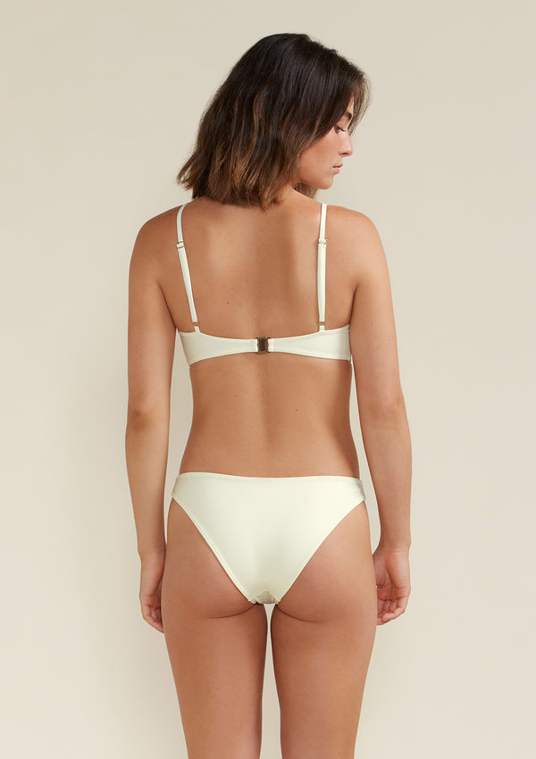 Model wears blake scoop bikini top and bottom in colour white dusk
