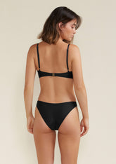 Model wearing Scoop bikini top in Black back view